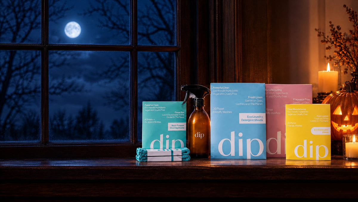 The Dip range on a windowsill at night with candles and a moonlit sky